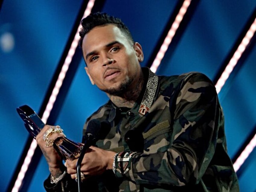 INGLEWOOD, CALIFORNIA - APRIL 03: Singer Chris Brown accepts the award for Best R&B Artist