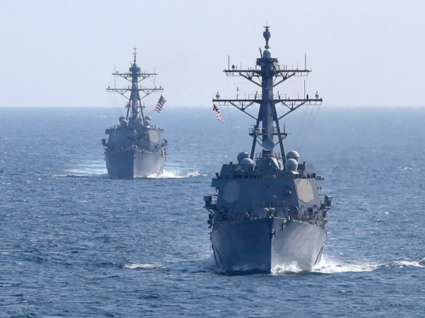 The guided-missile destroyers USS Forrest Sherman (DDG 98), right, and USS Arleigh Burke (
