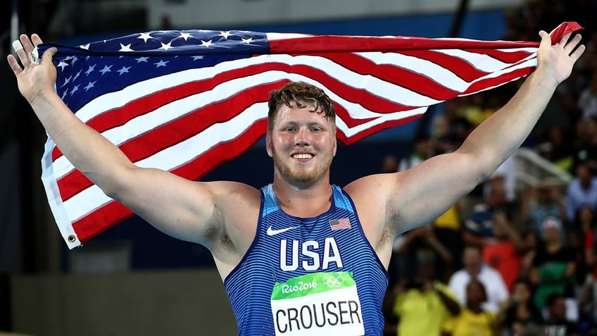 Ryan Crouser celebrates gold