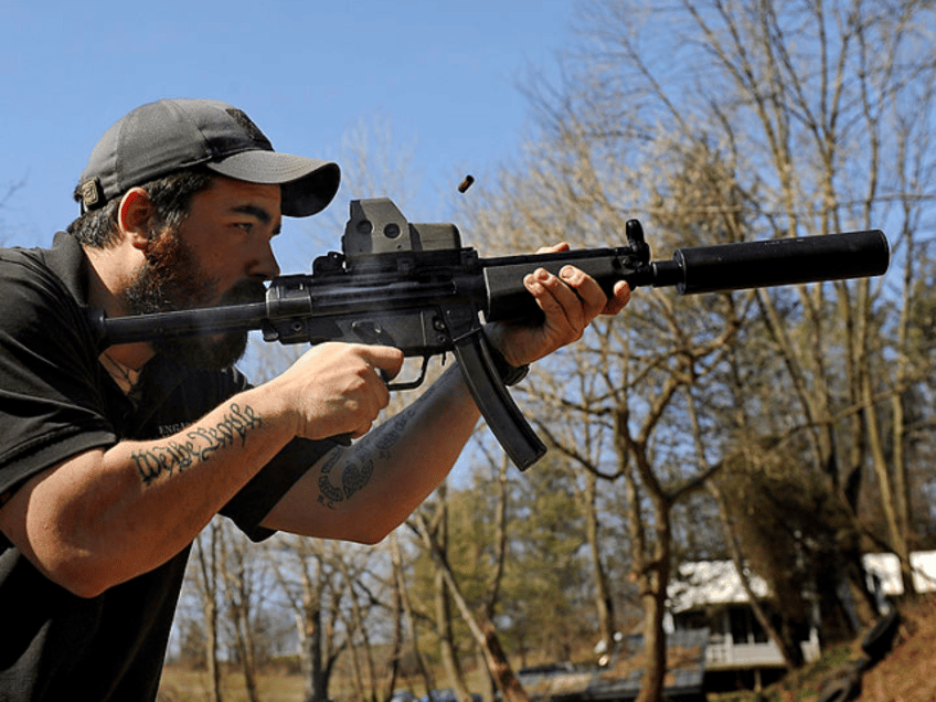 THURMONT, MD - MARCH 12: There's burst of smoke and ejecting shell as A.J. Wynne shoots a