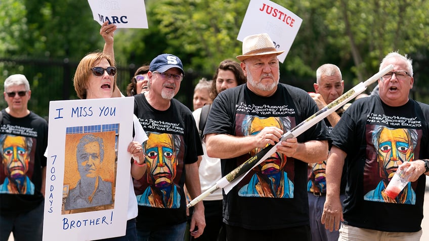 Family members of Marc Fogel at a rally outside the White House