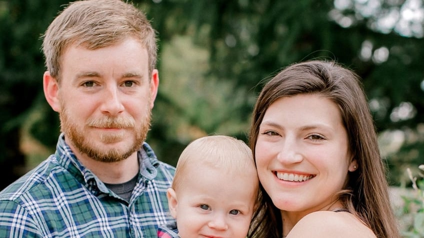 Tyler Wenrich, his wife and their toddler