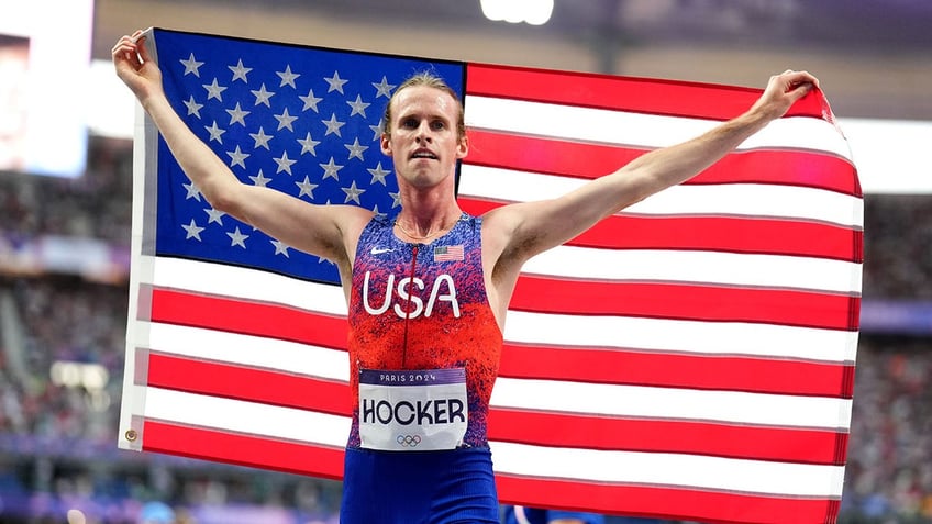 Cole Hocker with the American flag