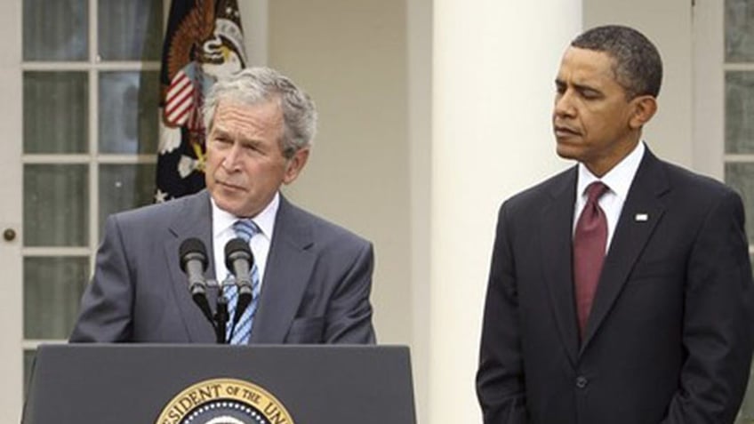President Obama listens to former President George W. Bush in the Rose Garden of the White House Jan. 16. (Reuters Photo)