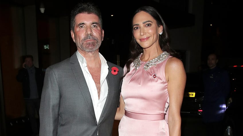 Simon Cowell and Lauren Silverman posing together