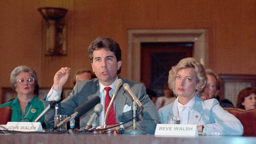 John Walsh and Reve Walsh in a court room looking somber and speaking to the public