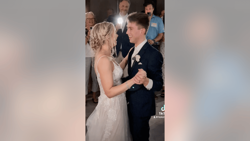 Newlyweds dancing at wedding