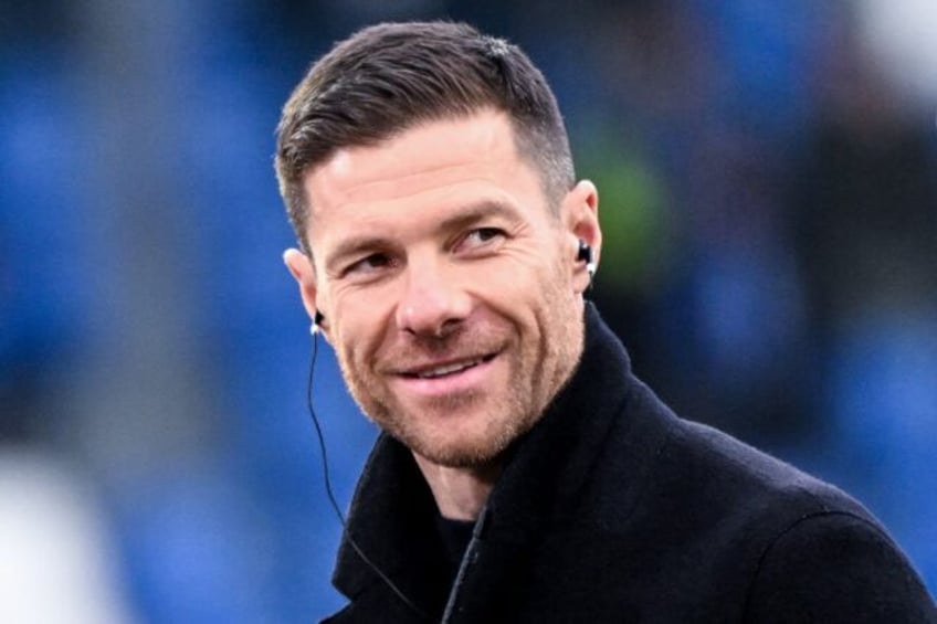 Xabi Alonso had been strongly linked to Liverpool but says he is staying at Bayern Leverku