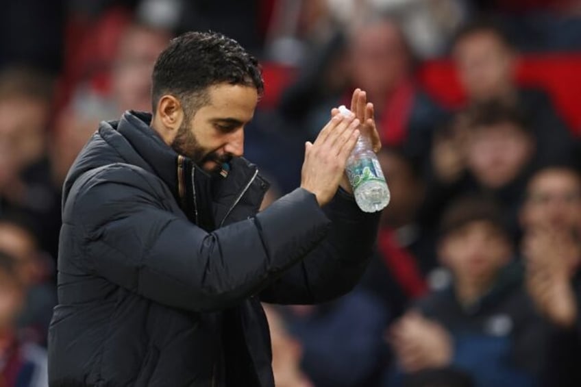 Manchester United manager Ruben Amorim applauds fans at Old Trafford