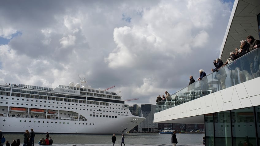 amsterdam looks to move cruise ship terminal in latest blow to citys tourism industry