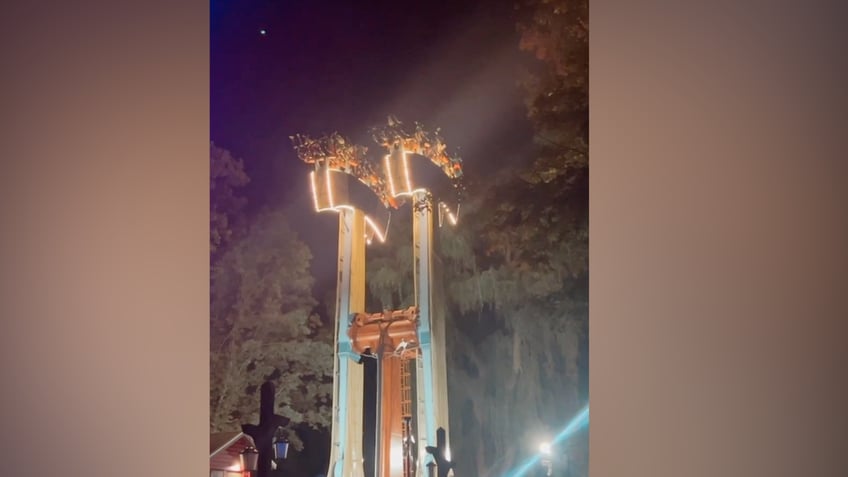 amusement park guests left 75 feet upside down for nearly 30 minutes on lumberjack ride