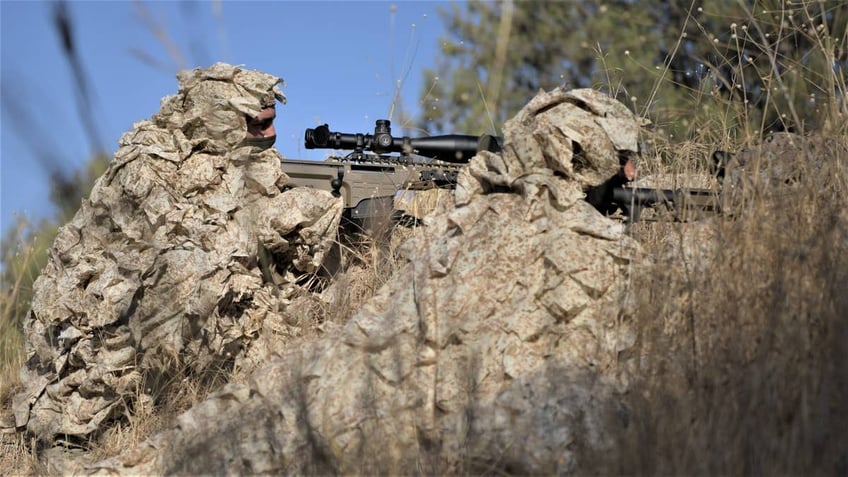 Yamam counter-terrorism unit snipers watching out for enemy forces. 