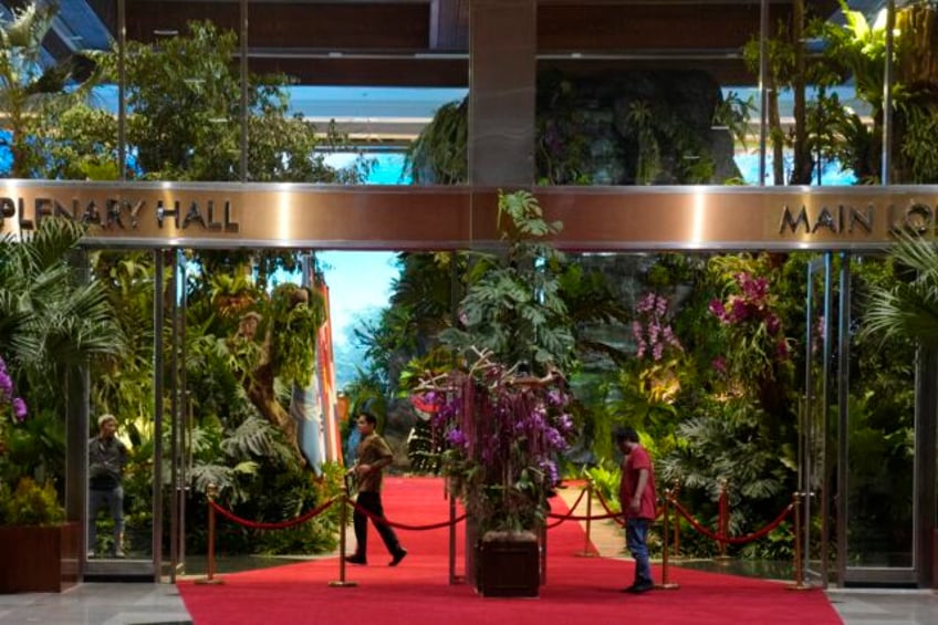 an orangutan chirping birds and a waterfall at indonesian venue contrast to the pollution outside