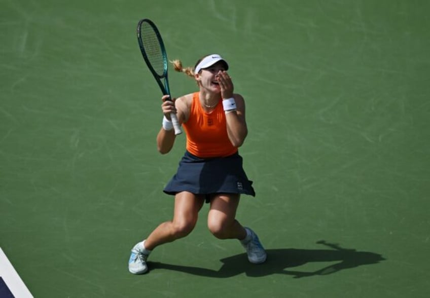 Russia's Mirra Andreeva celebrates her victory over world number one Aryna Sabalenka of Be