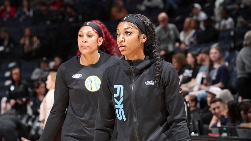 Angel Reese and Kamilla Cardoso warm up before a WNBA game