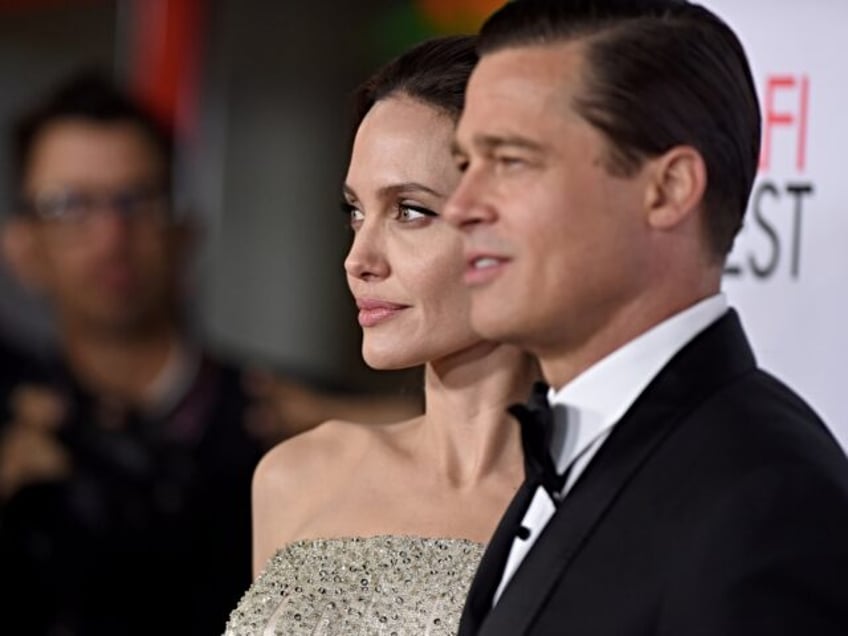 HOLLYWOOD, CA - NOVEMBER 05: Actors Angelina Jolie and Brad Pitt arrive at the AFI FEST 20