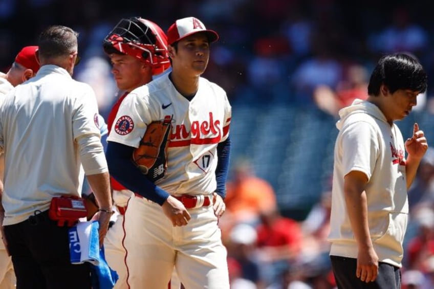 angels ace ohtani departs mound early with arm fatigue