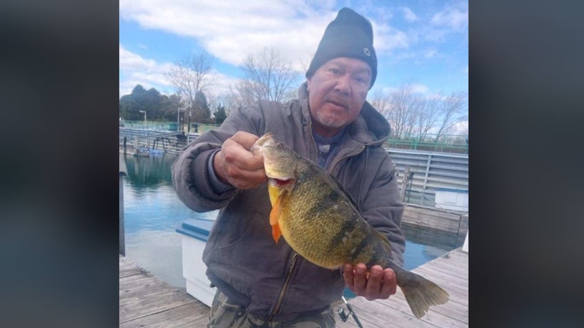 Blas Lara holding perch