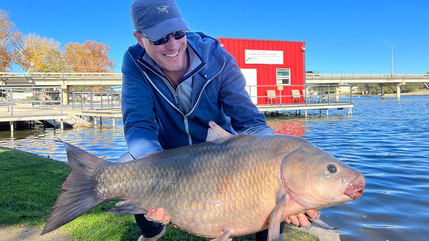 Art Weston holding record breaking fish