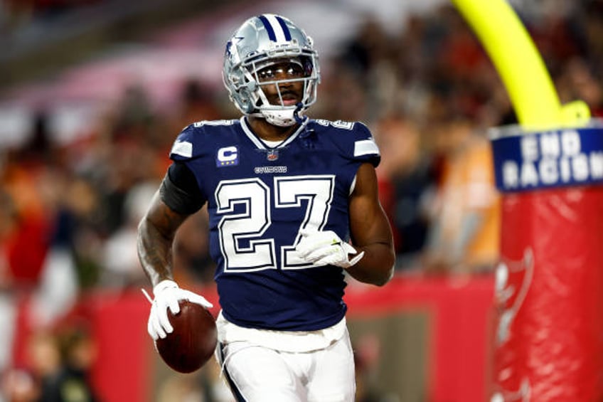 Jayron Kearse of the Dallas Cowboys celebrates after intercepting a pass during the second quarter of an NFL wild card playoff football game against...