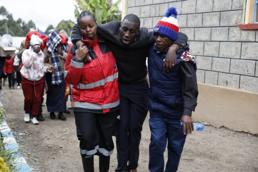 Distraught relatives were taken to the burnt-out dormitory