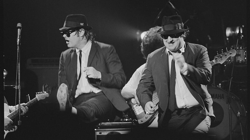 The Blues Brothers on stage performing