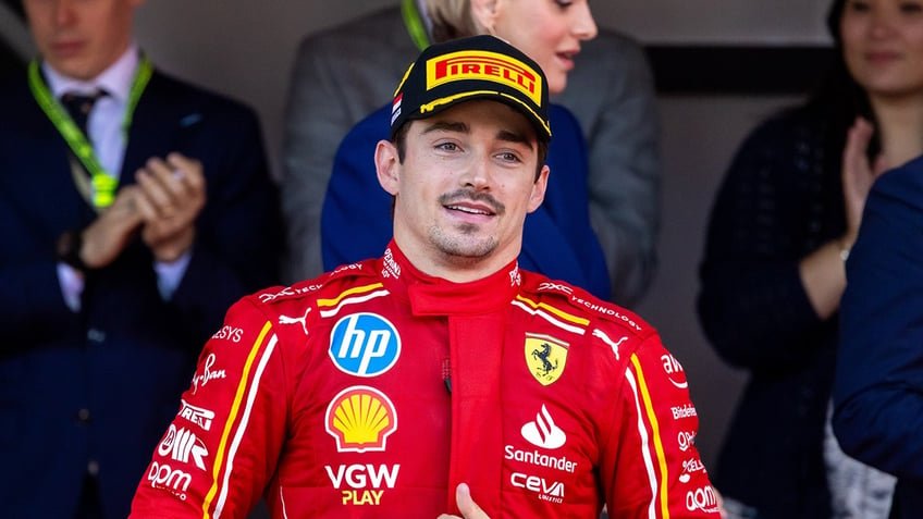 Charles LeClerc walks on track