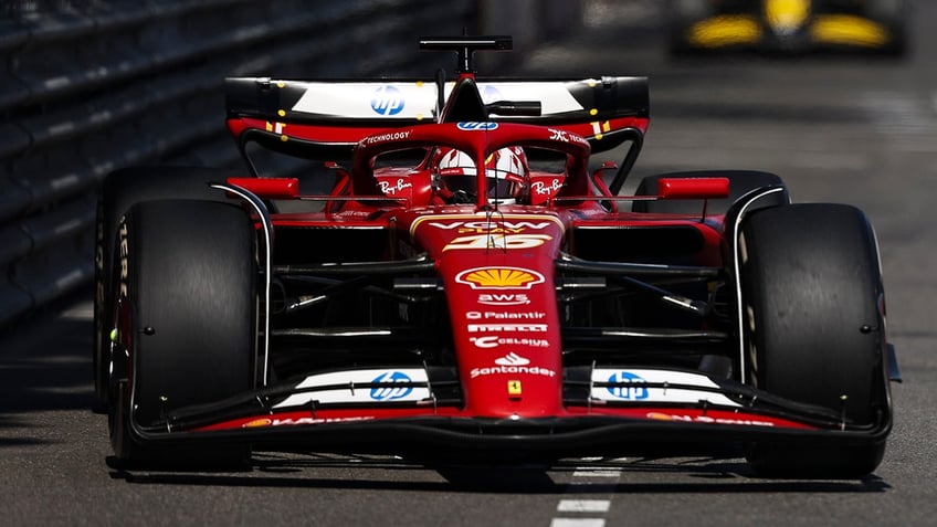 Charles LeClerc drives on racetrack