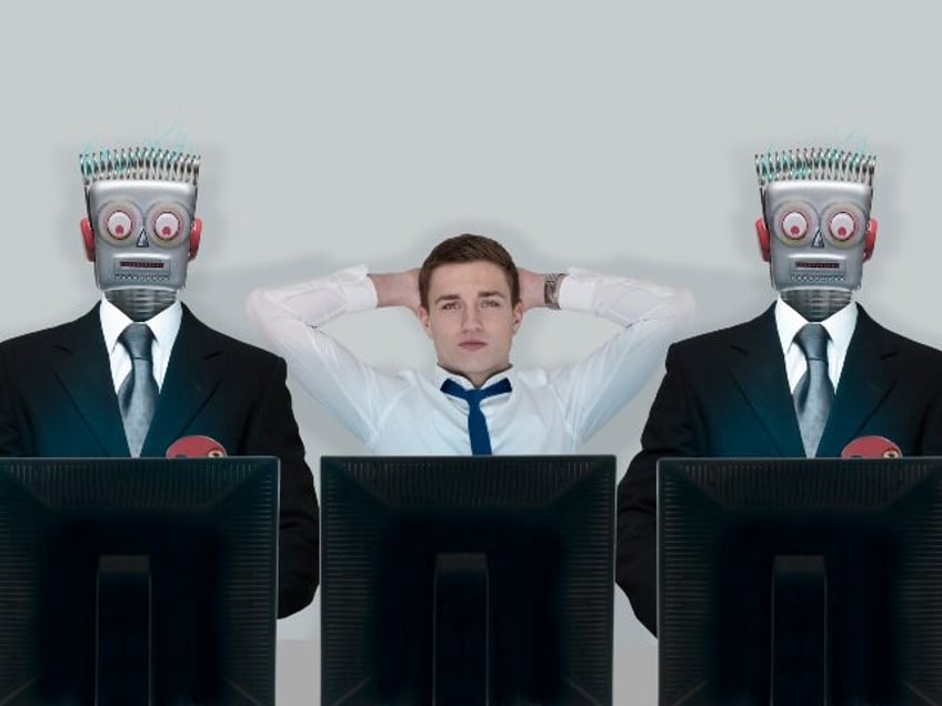 Human flanked by AI-powered worker robots