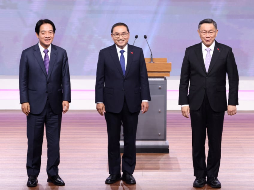 L-R) Lai Ching-te, presidential candidate from the ruling Democratic Progressive Party (DPP), Hou Yu-ih, presidential candidate from the main opposition Kuomintang (KMT), and Ko Wen-je, presidential candidate from the opposition Taiwan People's Party (TPP), pose for a picture during a debate in Taipei on December 30, 2023. (Photo by Pei Chen / POOL / AFP) (Photo by PEI CHEN/POOL/AFP via Getty Images)