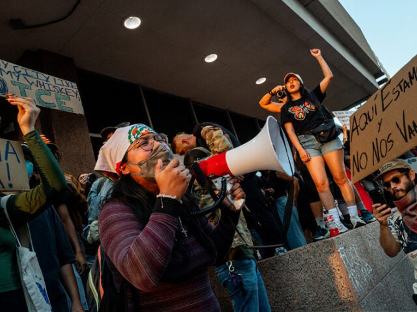 AUSTIN, TEXAS - JUNE 09: People rally in front of the J.J. Pickle Federal Building during