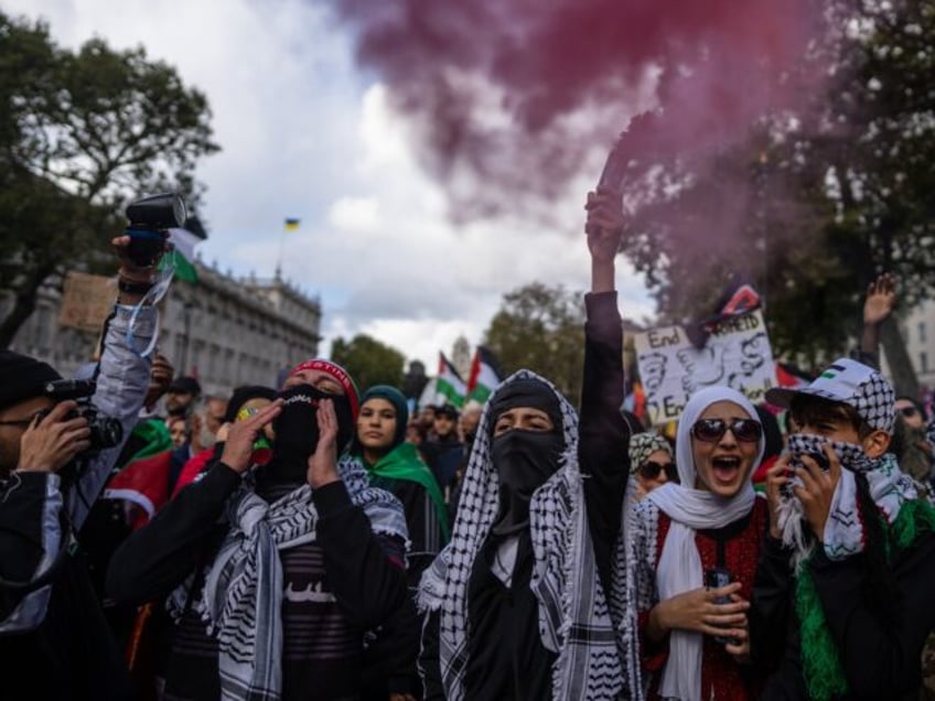 anti israel activists wave black jihad flag celebrate hamas terrorists at pro palestine protest in london