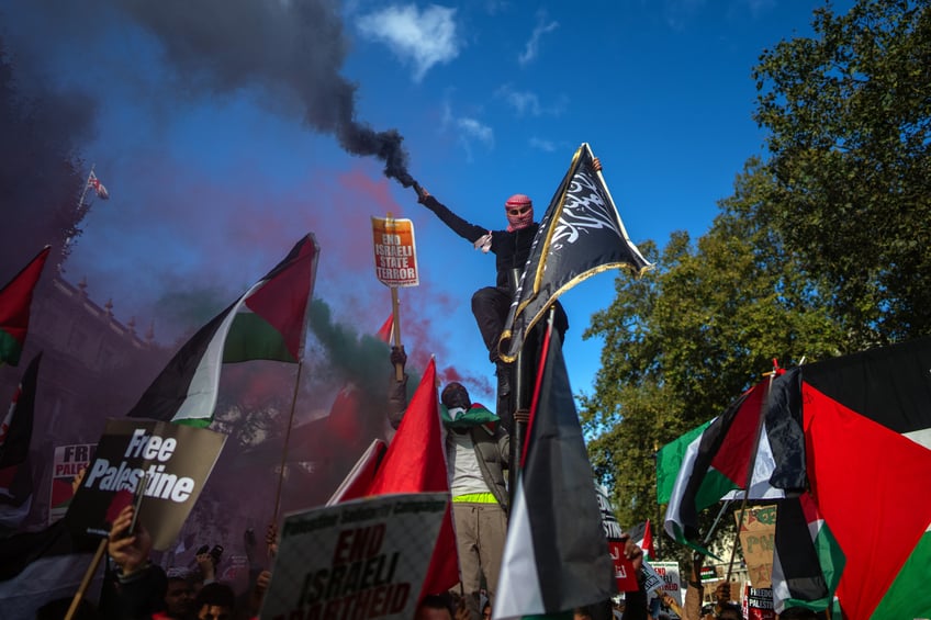 anti israel activists wave black jihad flag celebrate hamas terrorists at pro palestine protest in london