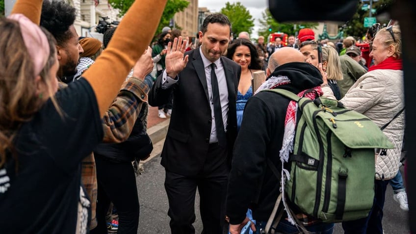 Man walking through protests