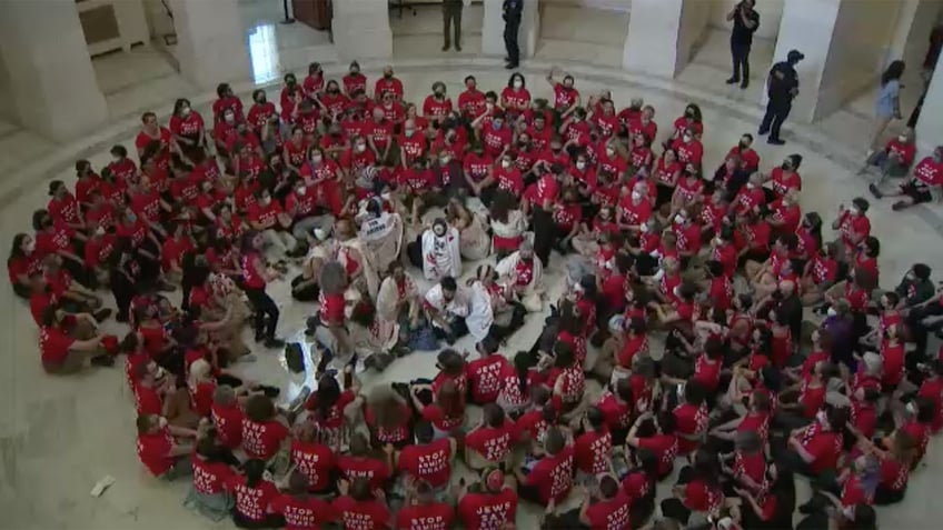 Protesters in red shirts