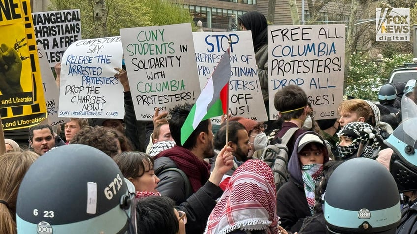 Pro-Palestine protesters demonstrate along NYPD police lines outside of Columbia University’s campus