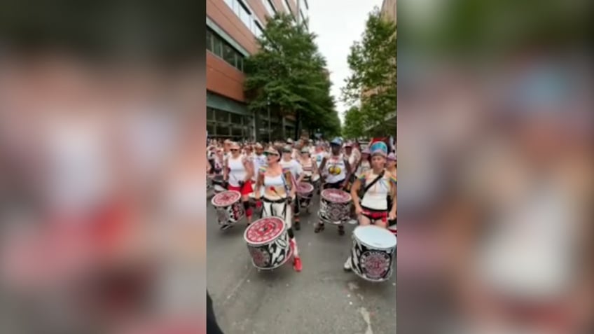 anti-israel marchers beat drums during street march
