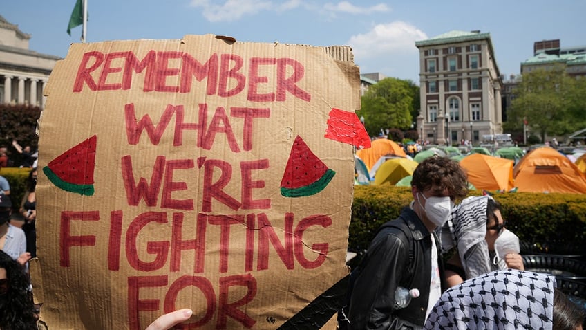 "remember what we're fighting for" sign at anti-Israel rally