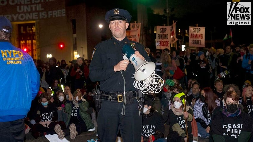 NYPD officer with airhorn