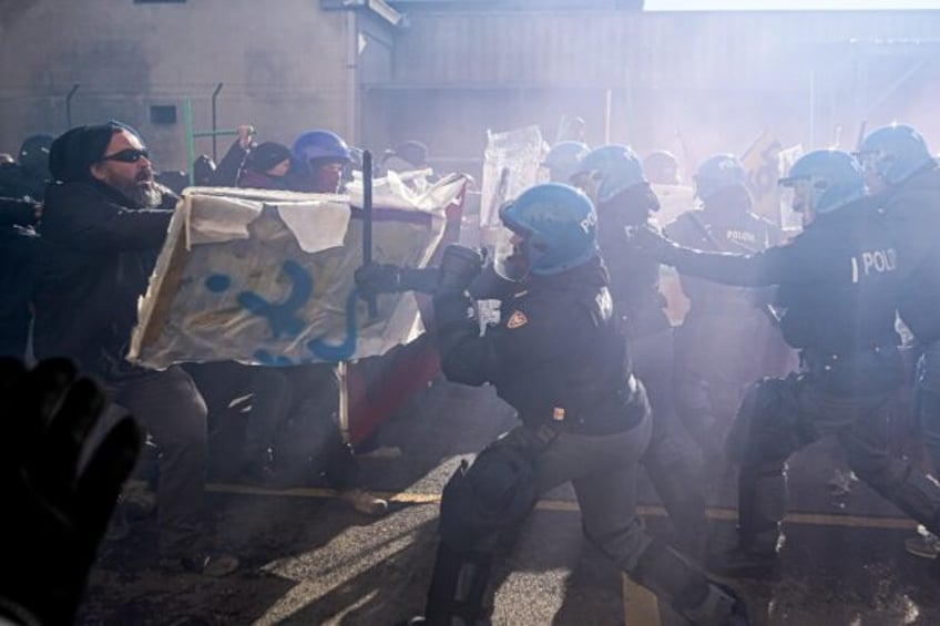 Police used water cannon on demonstrators who fired smoke bombs as violence erupted after a planned march by hundreds of people, some holding banners saying 'Free Palestine' and 'Stop Bombing Gaza'