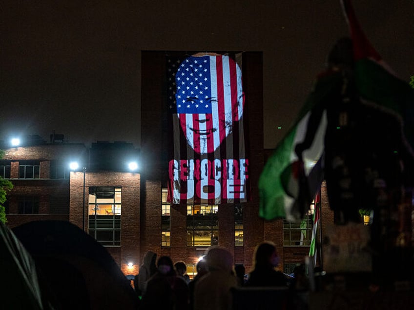 WASHINGTON, DC - MAY 3: An image of President Joe Biden with the words "Genocide Joe" are