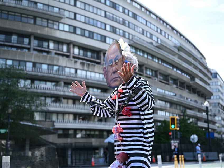 Pro-Palestinian activists demonstrate near the Watergate hotel ahead of the visit of Israe