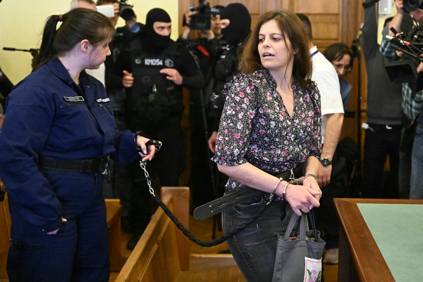 Italian teacher Ilaria Salis arrives in the Hungarian court of Budapest on March 28, 2024 ahead her trial for attacking neo-Nazis. Salis was arrested in Budapest in February 2023 and with three counts of attempted assault and accused of being part of an extreme left-wing organisation following a counter-demonstration against a neo-Nazi rally. (Photo by Attila KISBENEDEK / AFP) (Photo by ATTILA KISBENEDEK/AFP via Getty Images)