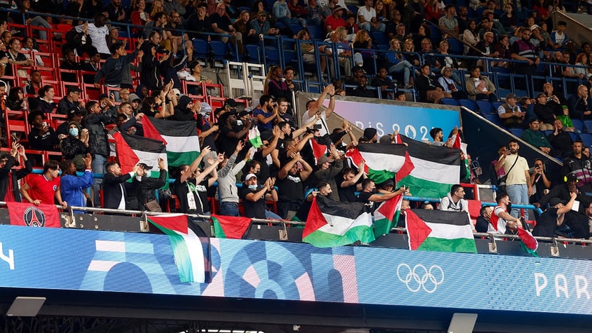 Anti-Israel protesters in stands