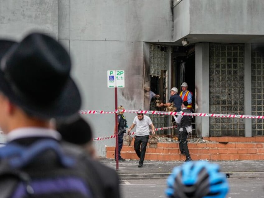 MELBOURNE, AUSTRALIA - DECEMBER 06: Members of the Synagogue recover items from the Adass