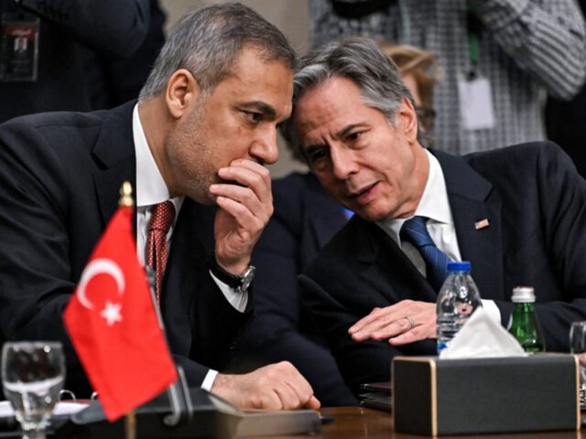 Turkey's Foreign Minister Hakan Fidan speaks with US Secretary of State Antony Blinken dur