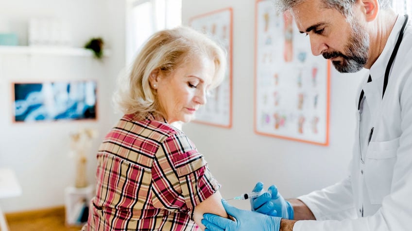 Woman getting vaccine