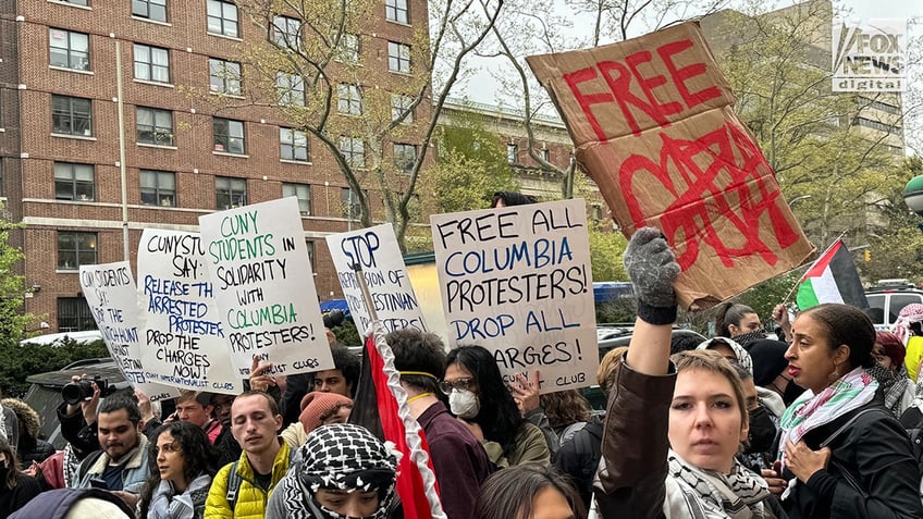 NYPD officers patrol as pro-Palestine protestors demonstrate outside of Columbia University’s campus