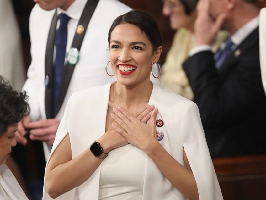 AOC smiles for the camera