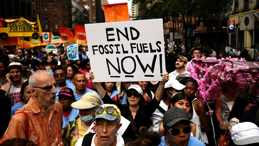 aoc joins thousands in new york climate change march with furious message for biden